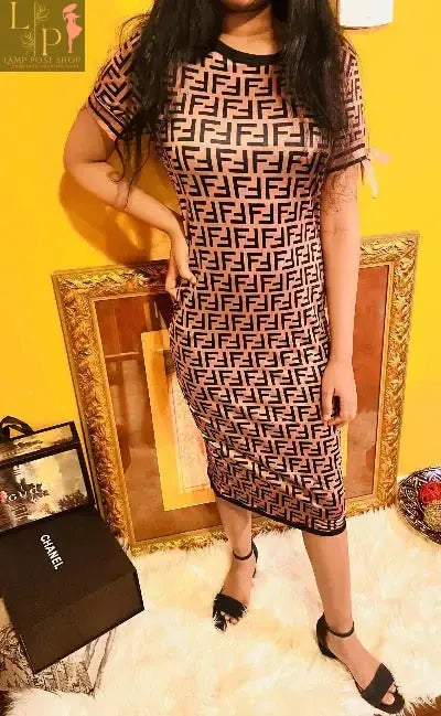 Brown women's long dress with short sleeves by Lamp Post, featuring a flowing design and elegant style.