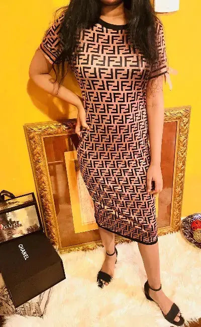 Brown women’s long dress with short sleeves by Lamp Post, flowing and elegant for casual or formal occasions.