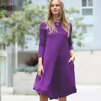 Dark blue women’s dress by Lamp Post featuring a sexy signature style and side pockets, perfect for casual or semi-formal wear.
