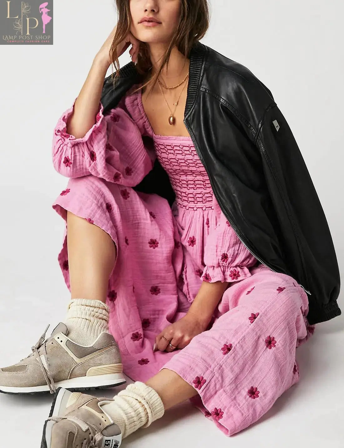 Pink floral dress for women by Lamp Post, featuring a large floral pattern, sleeveless design, perfect for spring and summer wear.