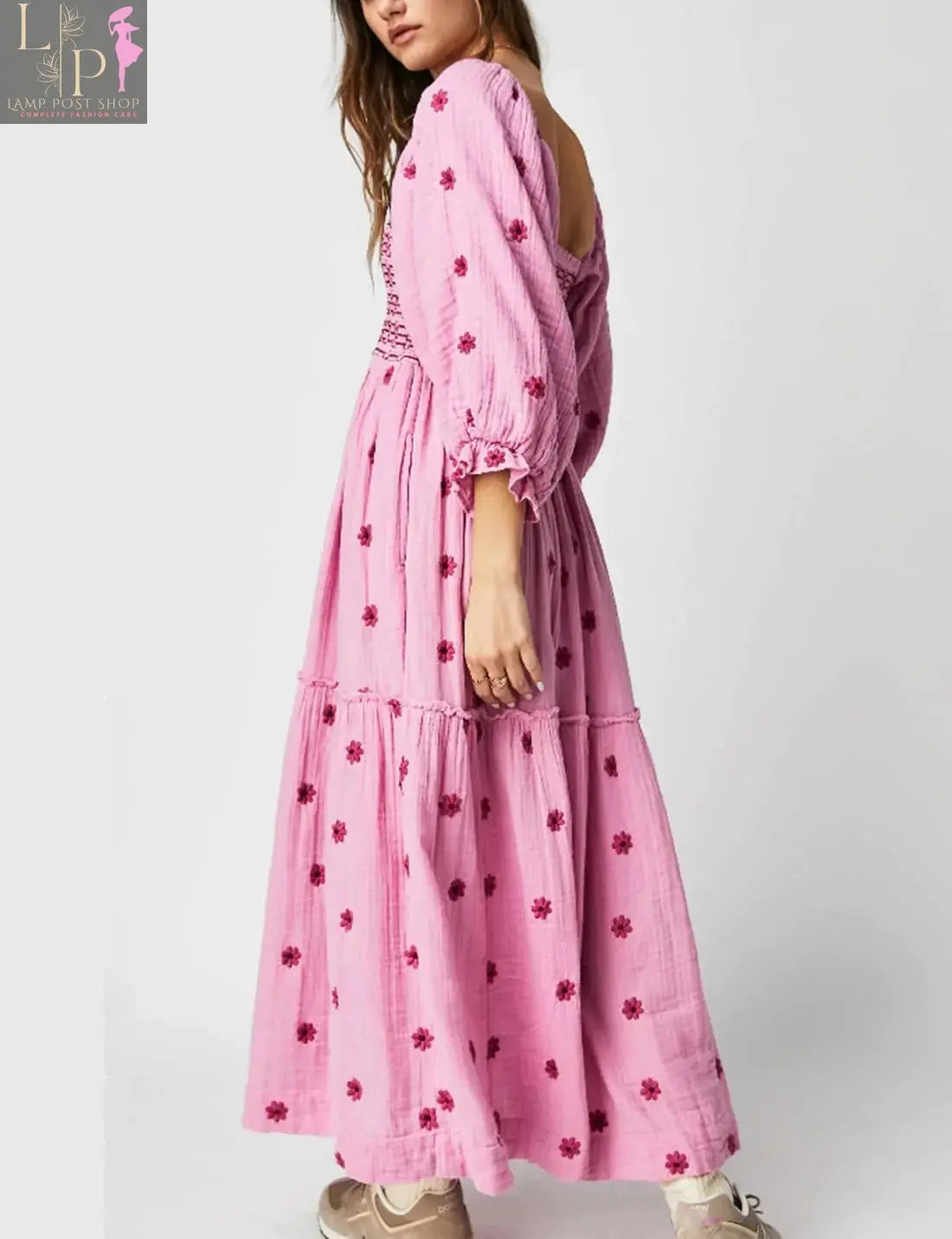 Pink floral dress for women by Lamp Post, featuring a large blooming pattern and flowing fabric, perfect for casual or summer wear.