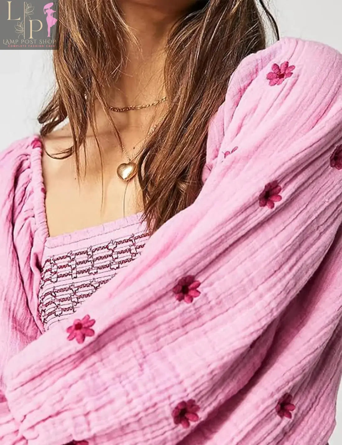 Pink floral dress for women by Lamp Post, flowing design with large floral print, perfect for casual or summer wear.