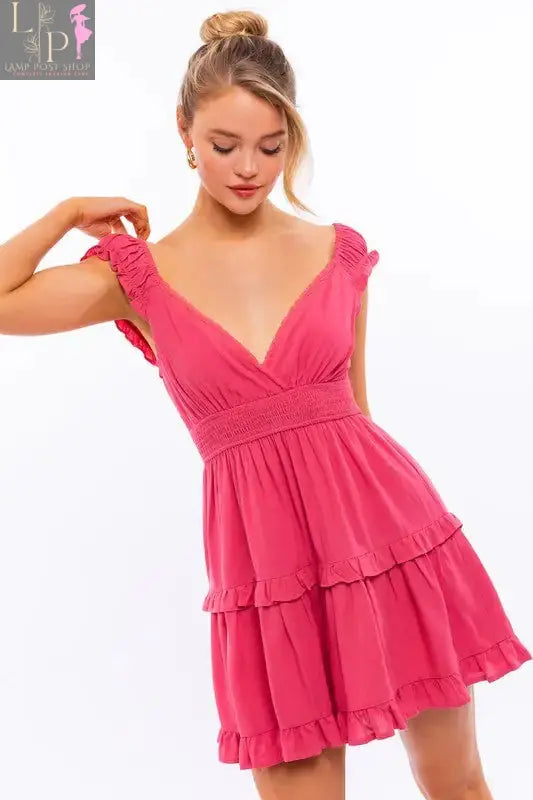Light blue cap sleeve ruffle mini dress by Lamp Post, featuring a fitted bodice and playful ruffle details for a stylish look.