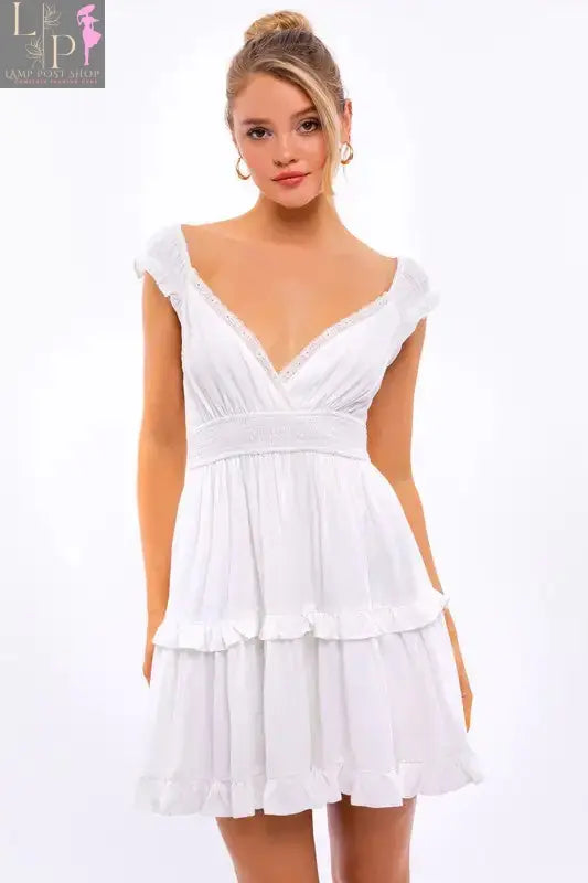 Pink Lamp Post women's cap sleeve ruffle mini dress with a fitted bodice and flared skirt, perfect for casual or summer wear.