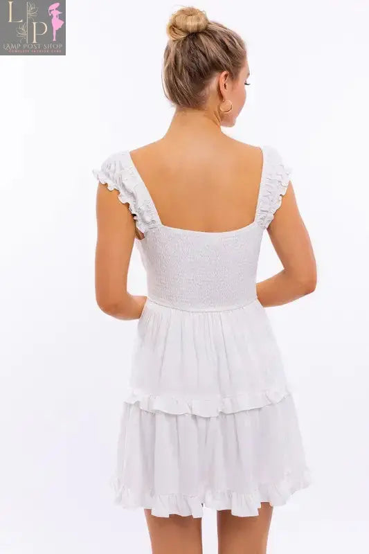 Pink Lamp Post women’s cap sleeve ruffle mini dress with a flowy silhouette and delicate ruffle details for a stylish summer look.