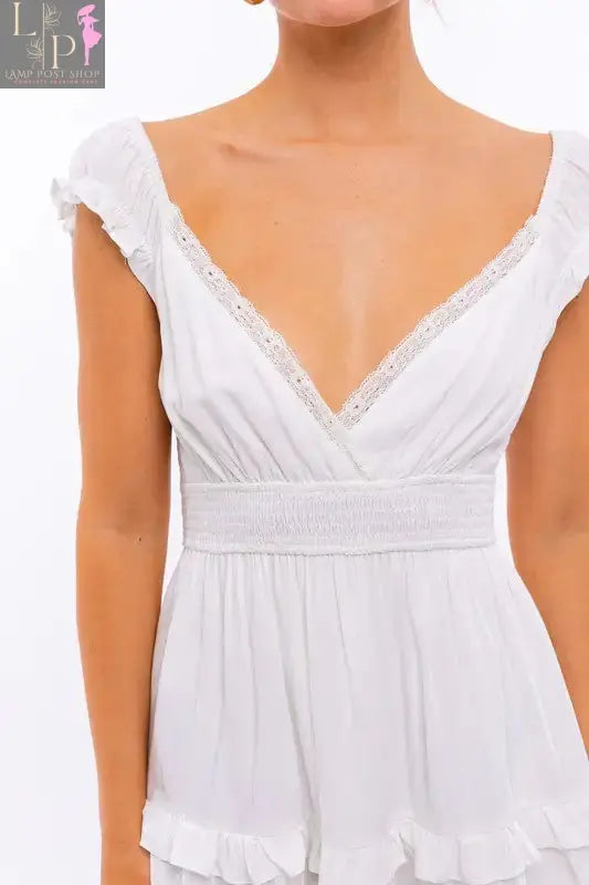 Pink Lamp Post women’s cap sleeve ruffle mini dress, stylish and lightweight for casual or summer wear.