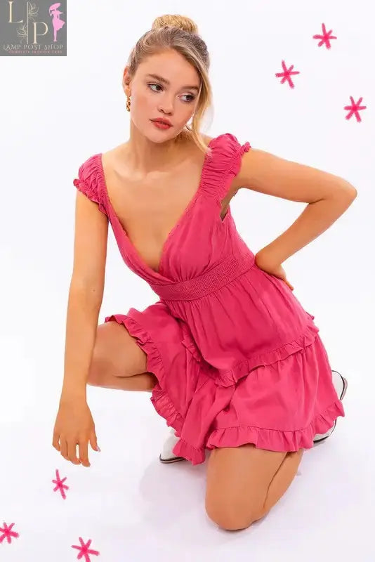 Pink Lamp Post women's cap sleeve ruffle mini dress featuring a fitted silhouette and feminine ruffle details.