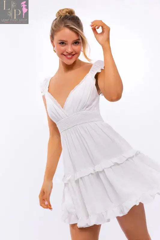 Pink Lamp Post women's cap sleeve ruffle mini dress with a fitted bodice and flared skirt, perfect for summer or casual outings.