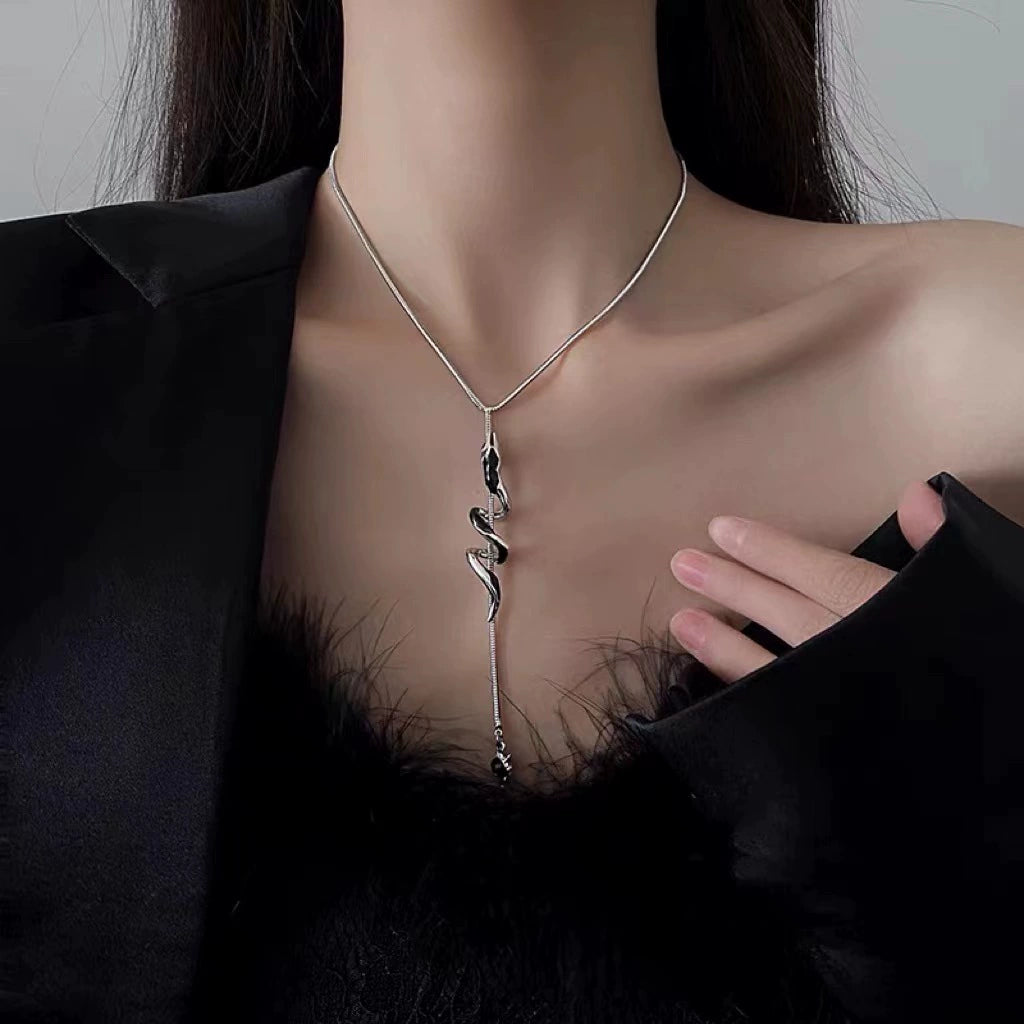 Snake shape ear hanging earrings for women by Lamp Post, featuring a stylish spirit snake design with ear holes.