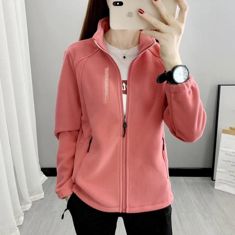 Beige women's winter running jacket by Lamp Post, cozy sweatshirt coat designed for cold weather outdoor exercise.