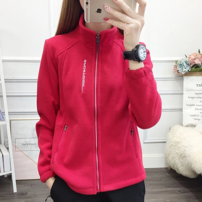Beige women's winter running jacket by Lamp Post, insulated sweatshirt coat designed for outdoor exercise and cold weather.