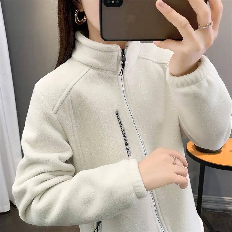 Beige women's winter running jacket by Lamp Post, cozy sweatshirt coat with a relaxed fit, perfect for cold-weather outdoor activities.