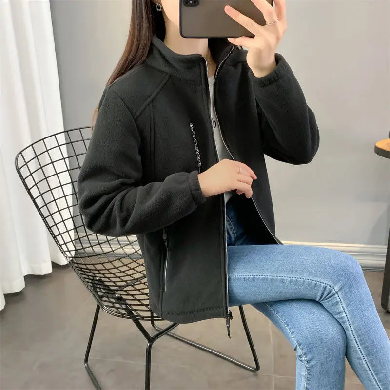Beige women's winter running jacket by Lamp Post, featuring a cozy sweatshirt coat design, suitable for cold weather running.