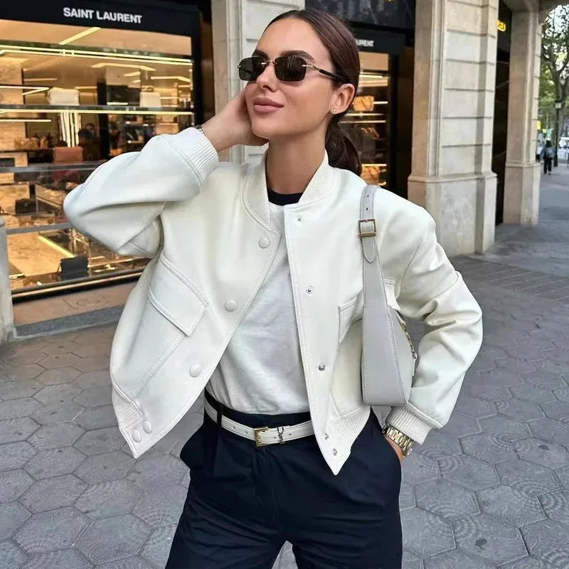 Beige women's long sleeve bomber jacket by Lamp Post, stylish crop outerwear with a fitted design and modern look.