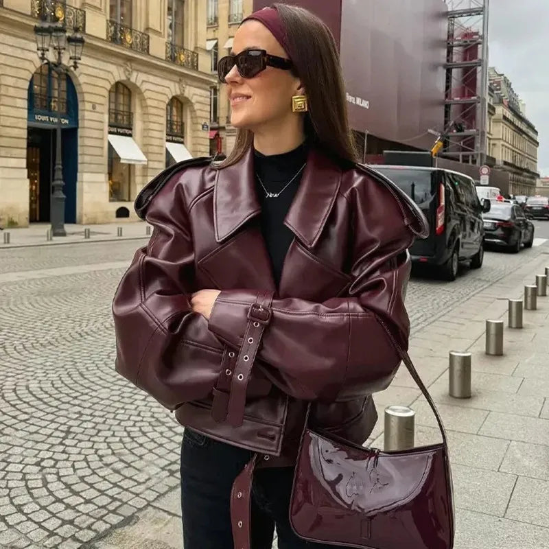 Women Lamp Post winter jacket with long sleeves, zipper pockets, in burgundy, stylish and warm for cold weather.