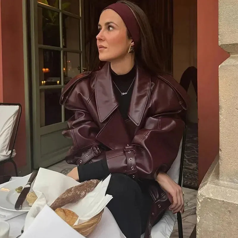Elegant women's burgundy winter jacket by Lamp Post with long sleeves, zipper pockets, and a stylish design.