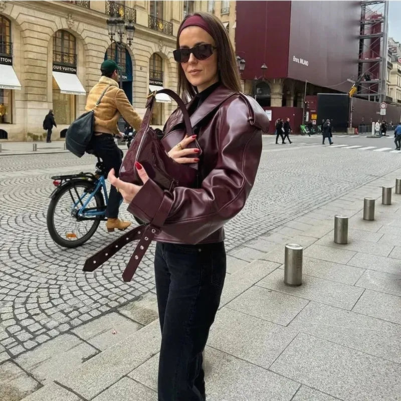 Women’s burgundy winter jacket by Lamp Post with long sleeves, zipper pockets, and a stylish, elegant design.
