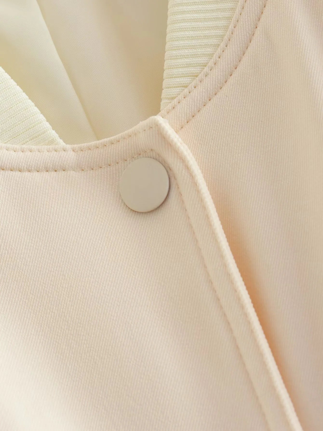 Beige Lamp Post women's bomber jacket with long sleeves, stylish outerwear for 2024, featuring a modern, fitted design.