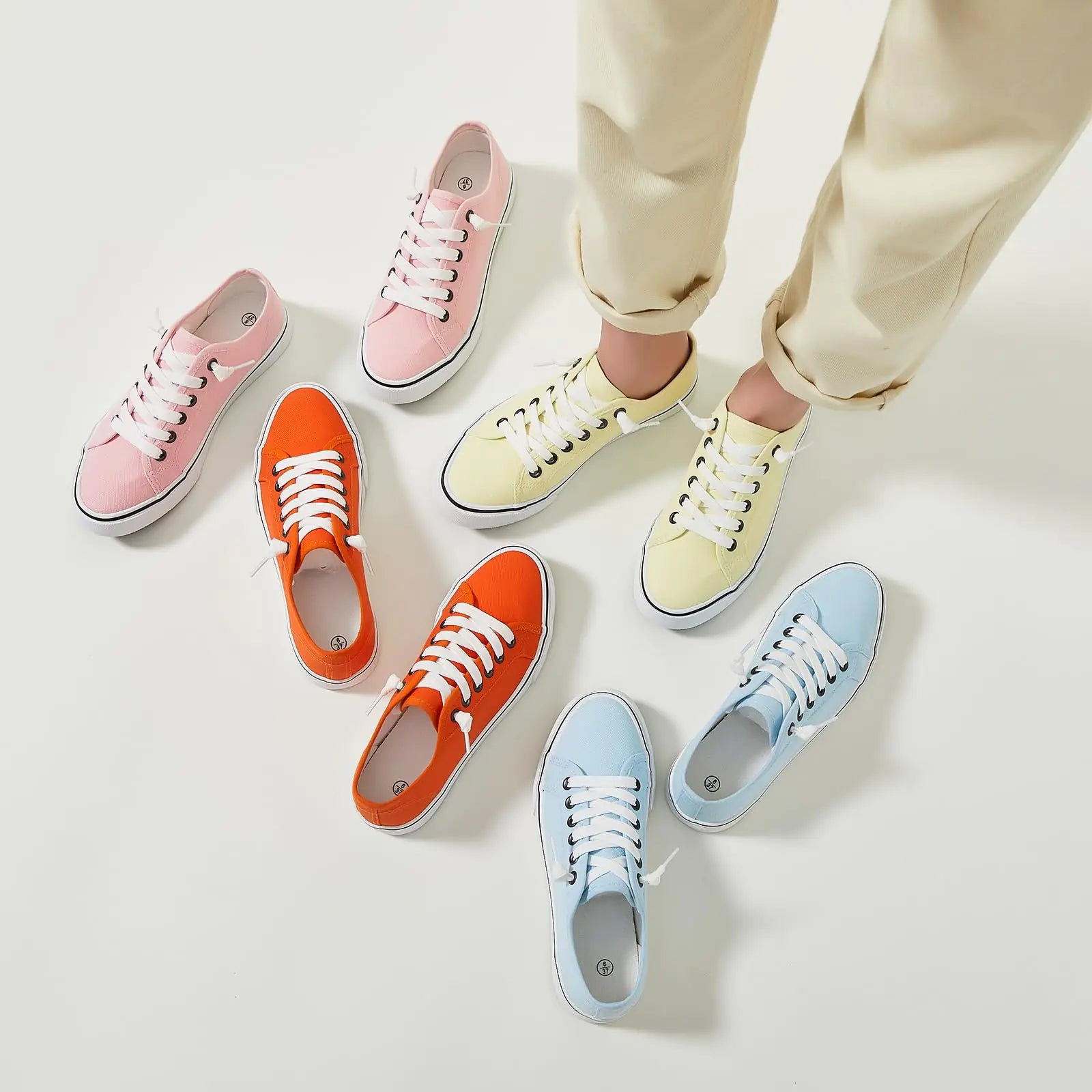 Yellow women's canvas sneaker by Lamp Post featuring a casual slip-on design and white rubber sole.