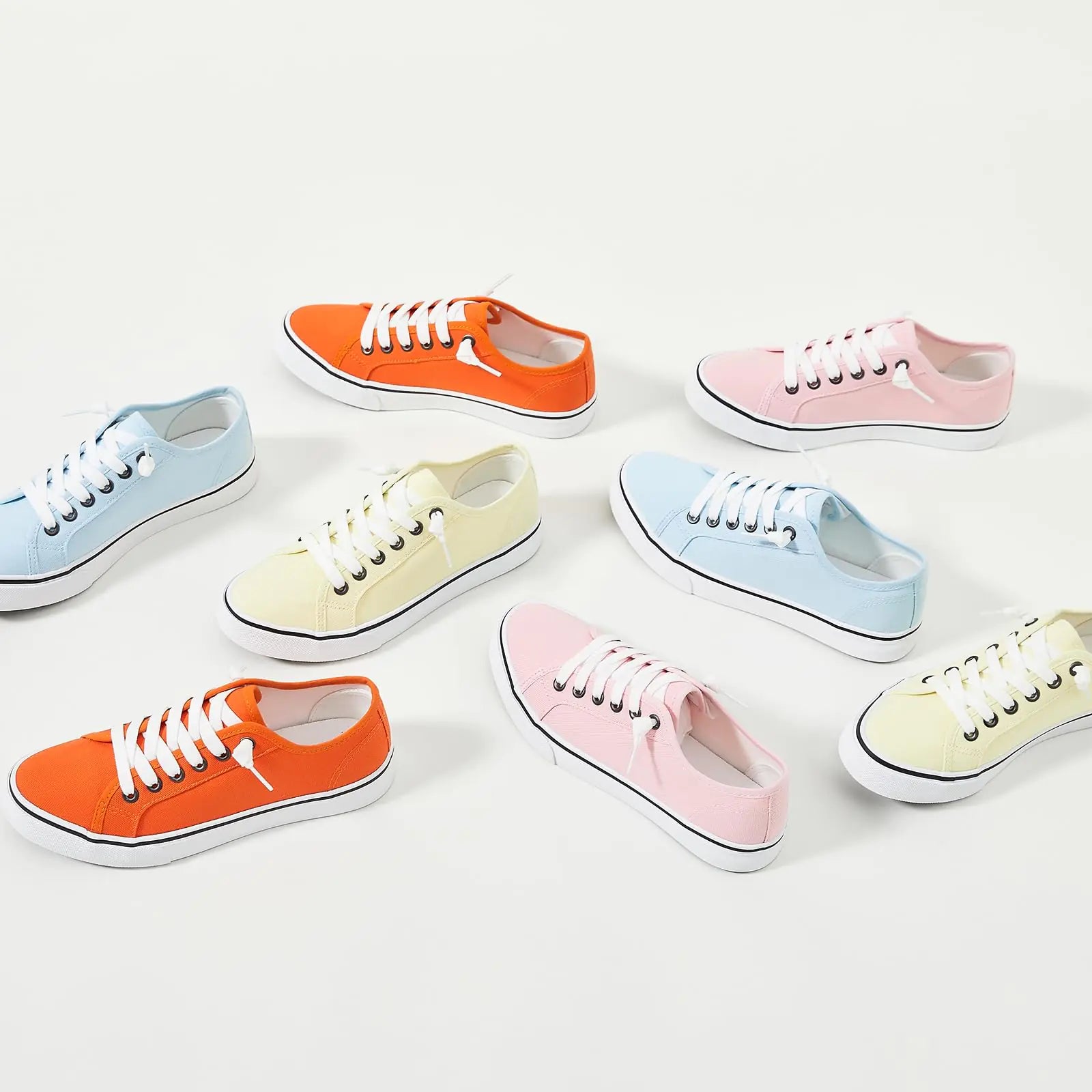Yellow women's canvas sneaker by Lamp Post with white rubber sole and casual lace-up design.