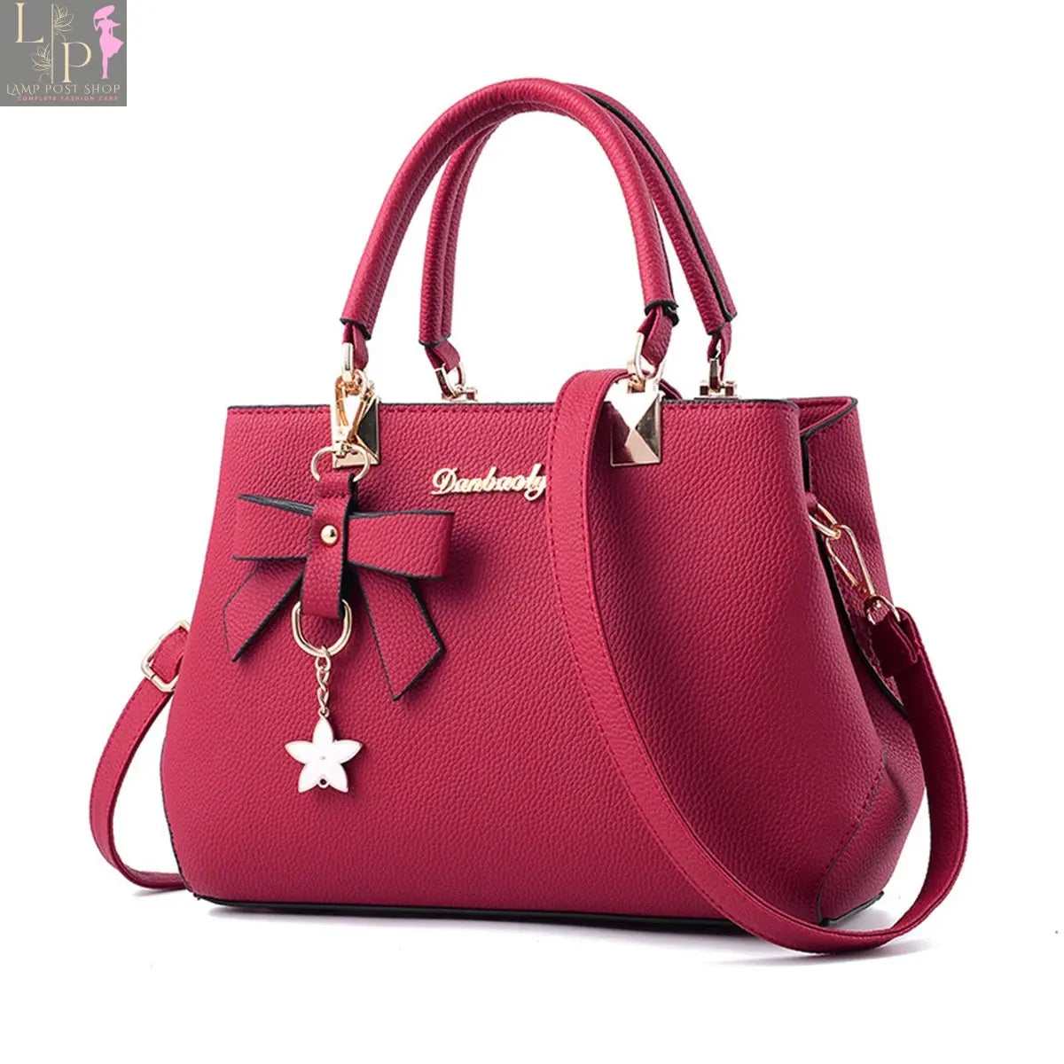 Pink classic elegant women's handbag with top handle, satchel style, and crossbody wallet design.