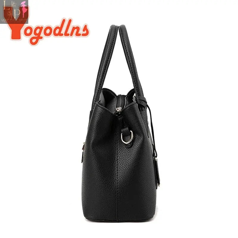 Leather designer women's handbag by Yogodlns, luxury fashion shoulder bag with structured shape and stylish pattern.