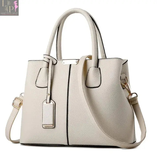 Leather designer women's handbag with pattern, luxury shoulder bag featuring a stylish purse design and spacious interior.