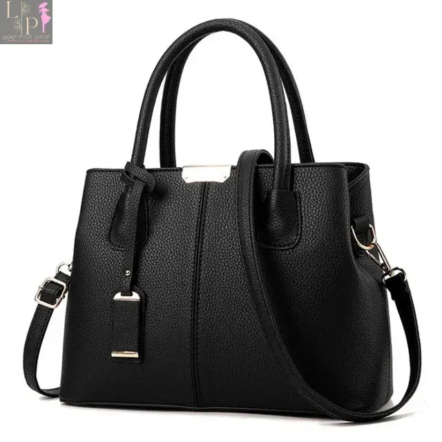 Leather designer handbag by Yogodlns, luxury women’s shoulder bag with patterned design, spacious interior, and elegant style.