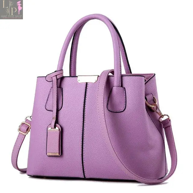Leather designer women's handbag featuring a stylish pattern, luxury shoulder bag with spacious interior and elegant design.