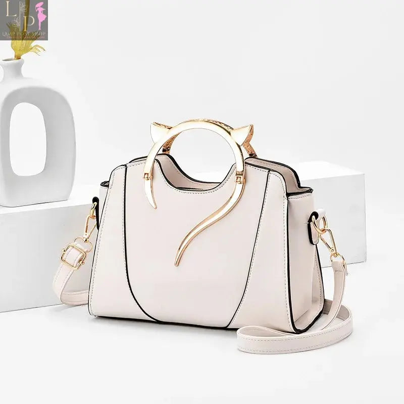 Small white leather shoulder bag from My Store, featuring a sleek design and adjustable strap, perfect for everyday use.