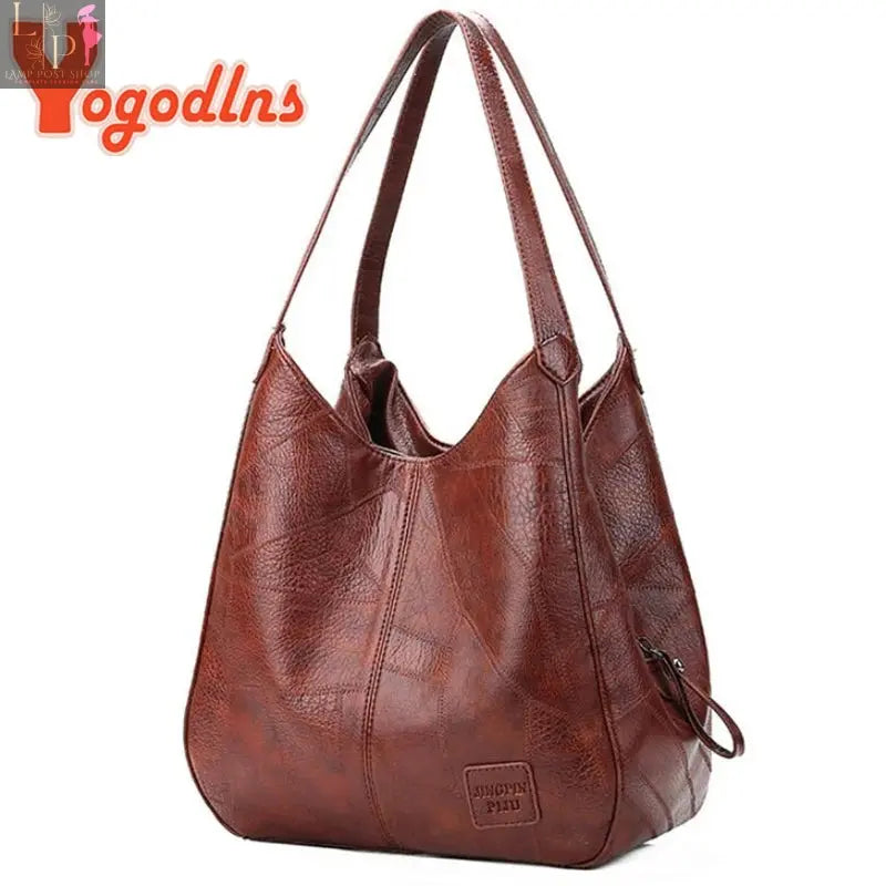 Vintage Yogodlns women's handbag with top handle, shoulder tote, designer style, in coffee color, showing front view and handles.