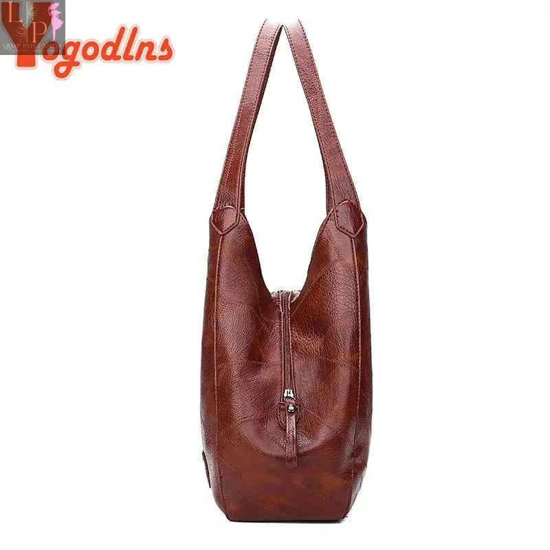 Vintage Yogodlns women’s handbag with top handle and shoulder strap, designer luxury tote bag with elegant design.