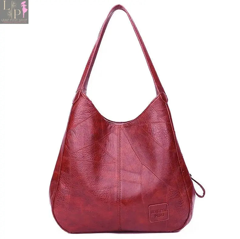 Vintage women’s leather shoulder tote bag with top handle, designer luxury handbag in coffee color, stylish and spacious.