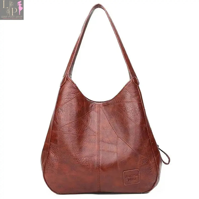 Vintage Yogodlns women’s leather shoulder tote bag with top handle, featuring a classic design and spacious interior.