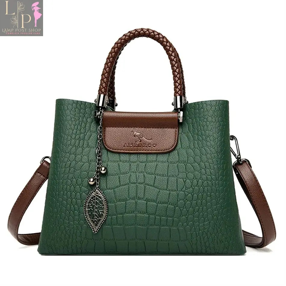 Green soft leather luxury handbag with three layers, shoulder strap, and spacious design for women’s shopping and everyday use.