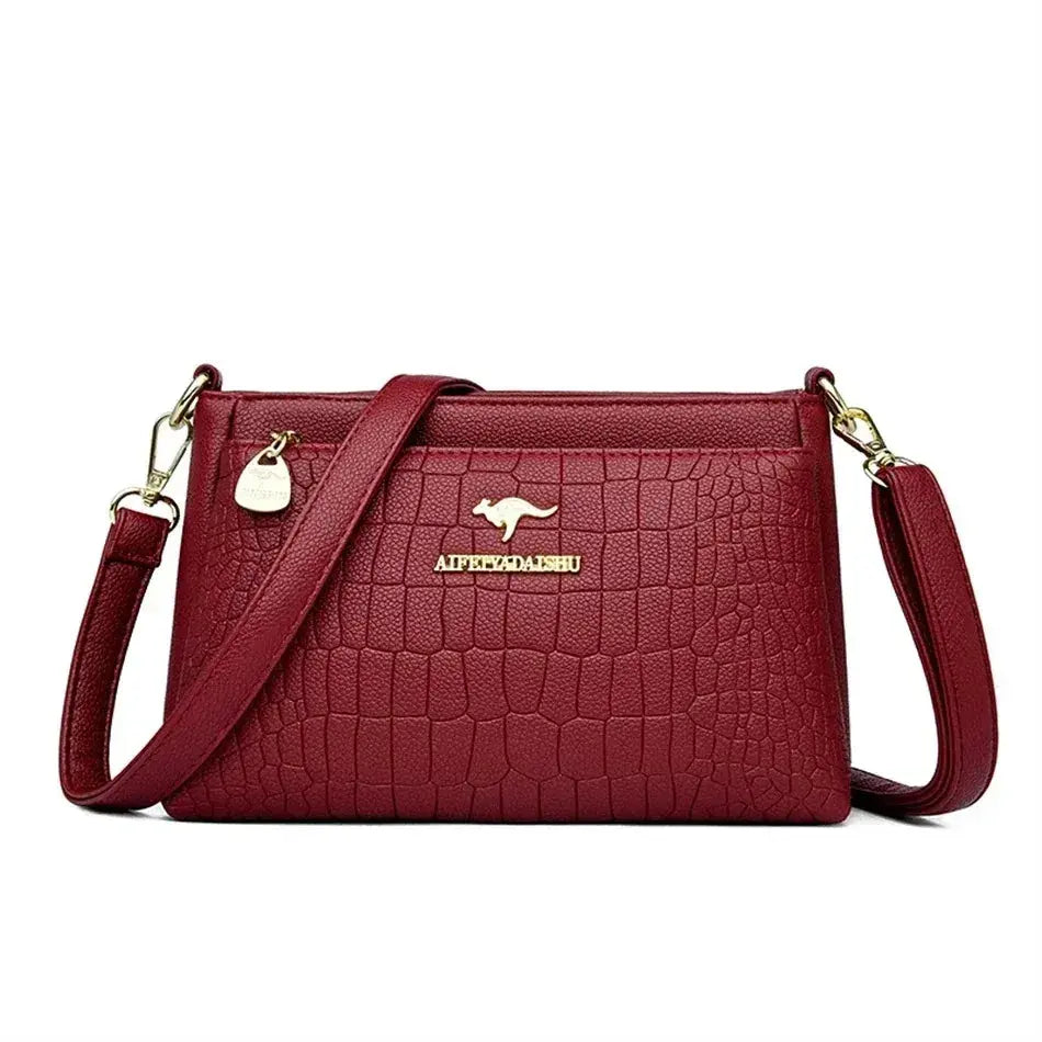 Green soft leather luxury handbag with three layers, shoulder strap, and large capacity for women, designer-style tote and crossbody bag.