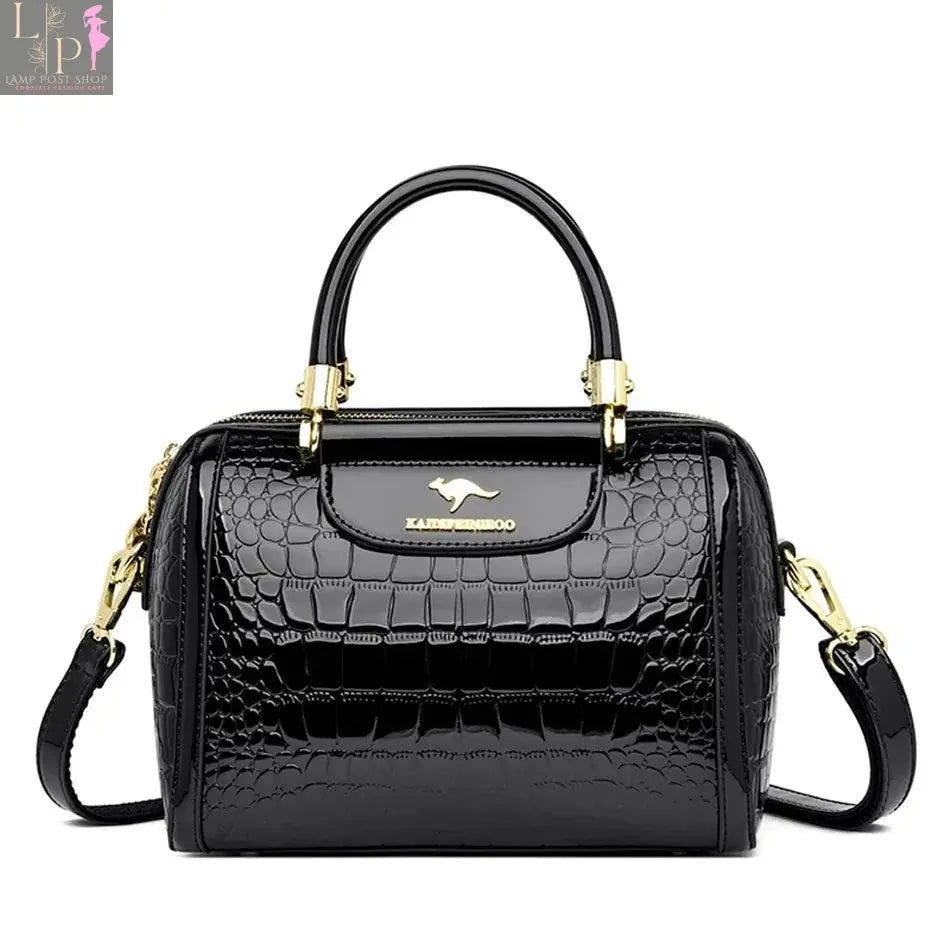 Green soft leather luxury handbag with three layers, shoulder strap, crossbody design, large capacity, and messenger tote style.