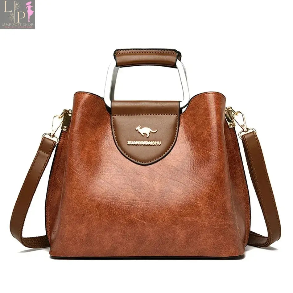 Green soft leather luxury women's handbag with three layers, shoulder strap, crossbody style, large capacity, tote design.
