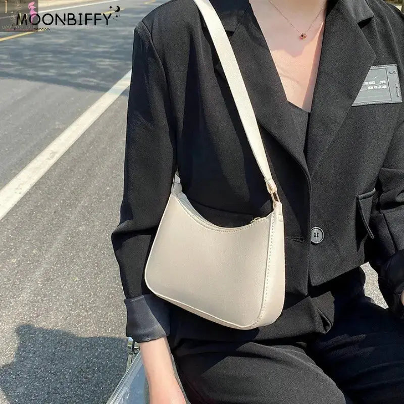 Khaki leather shoulder underarm bag for women, casual hobo style with spacious interior, stylish women's fashion handbag.