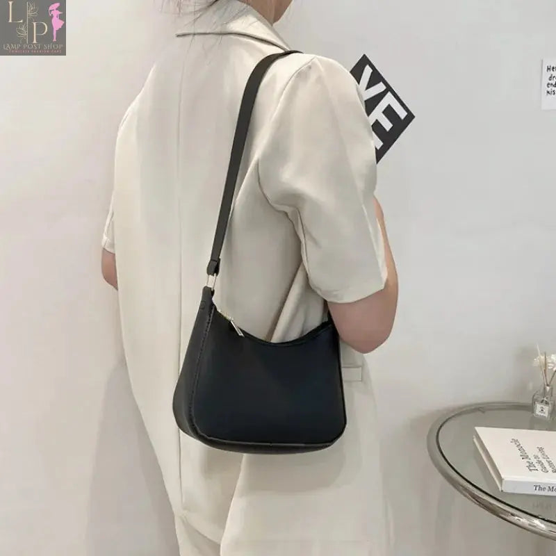 Khaki leather shoulder underarm bag for women, casual hobo style, featuring a spacious design with hand and shoulder carry options.