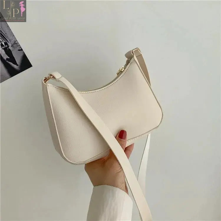 Khaki leather shoulder underarm bag for women, casual hobo style, fashionable women's handbag with adjustable strap.