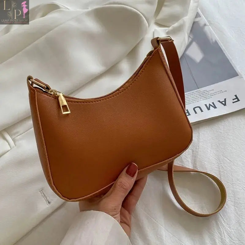 Khaki leather shoulder underarm bag for women, casual hobo style with spacious interior and adjustable strap.