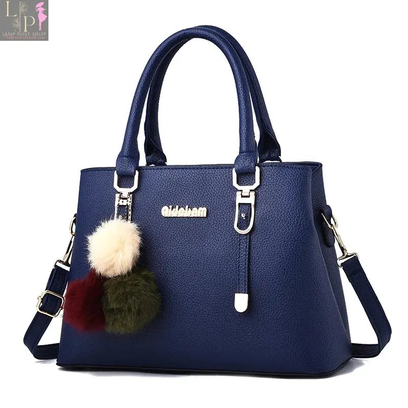 Leather women's casual tote bag with top handles, spacious interior, and stylish design perfect for everyday use.