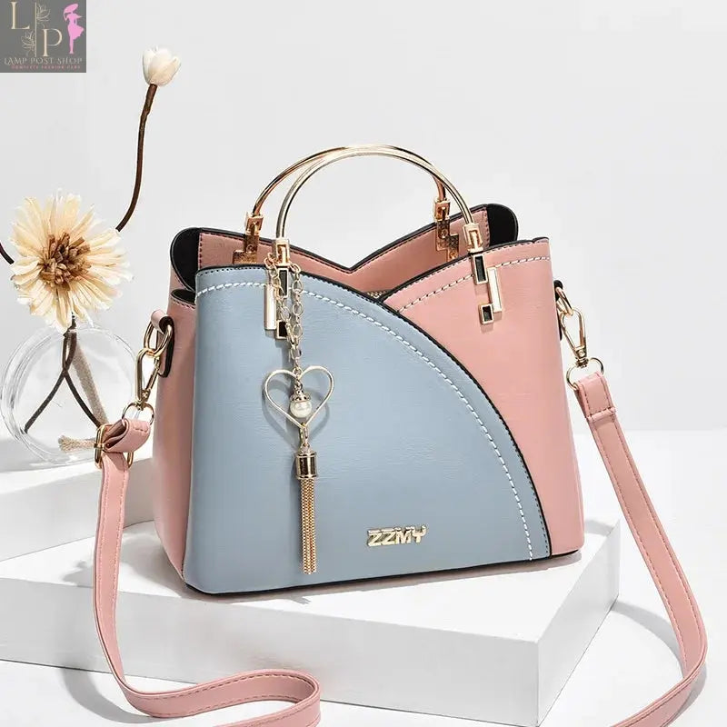 Wine-red women’s shoulder bag with white accents, stylish and versatile bag by My Store shown in the image.