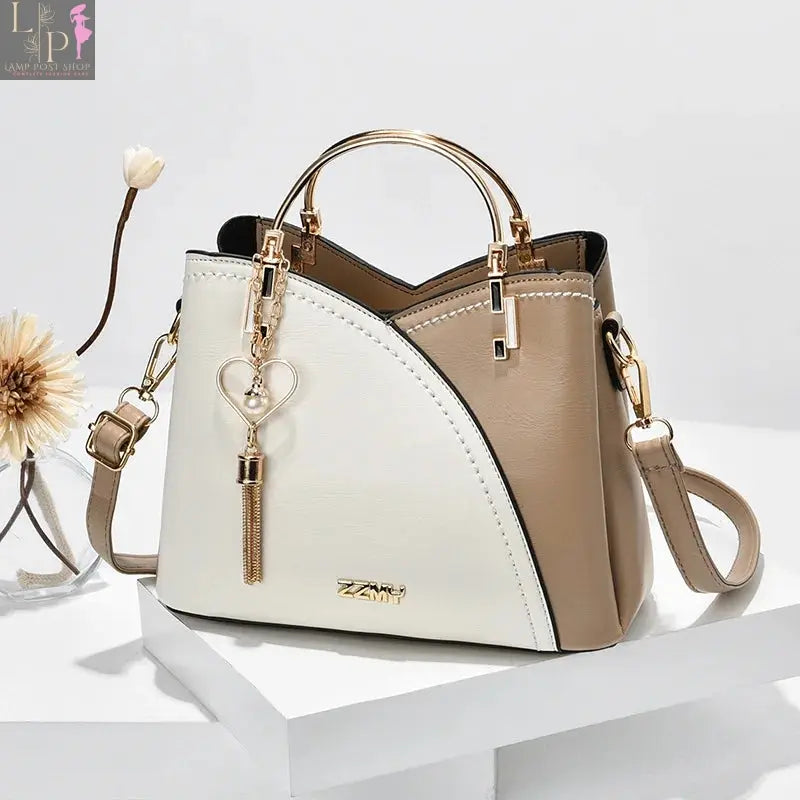 Wine red women’s shoulder bag from My Store featuring white accents and a stylish design.