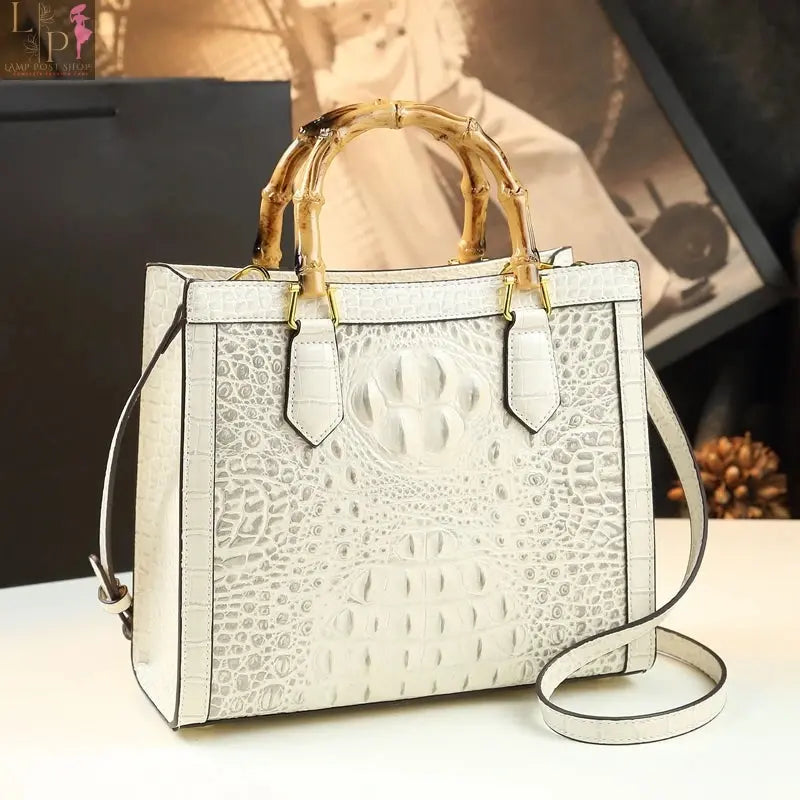 Beige and gray leather tote bags for women featuring stylish, spacious design and sturdy handles, ideal for everyday use.