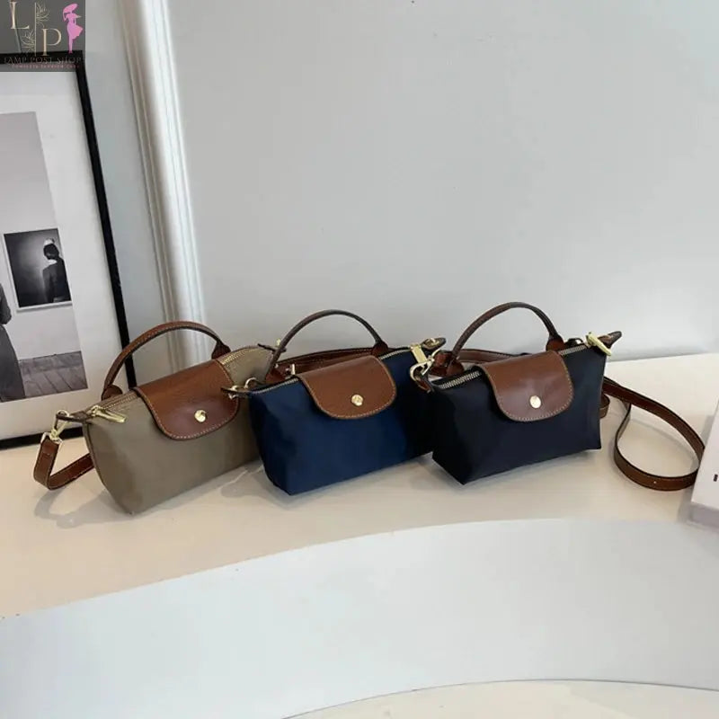 Black women and girls crossbody bag for 2024, stylish and compact, featuring adjustable strap and sleek design.
