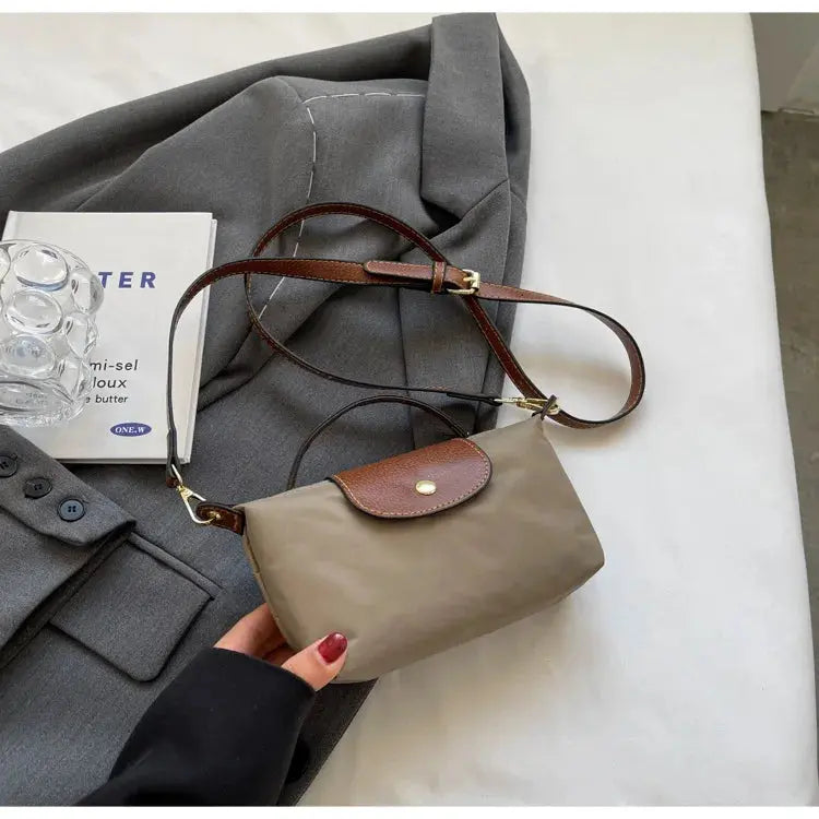 Black women and girls crossbody bag for 2024 with adjustable strap, stylish and functional accessory for everyday use.