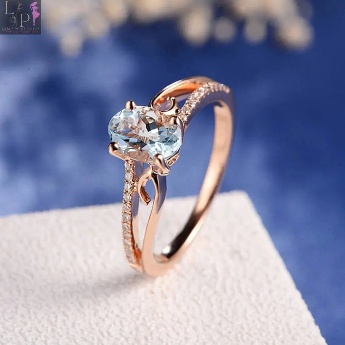Gold aquamarine ring with a large gemstone, perfect as a gift for mom or wife, featuring elegant and alluring design.