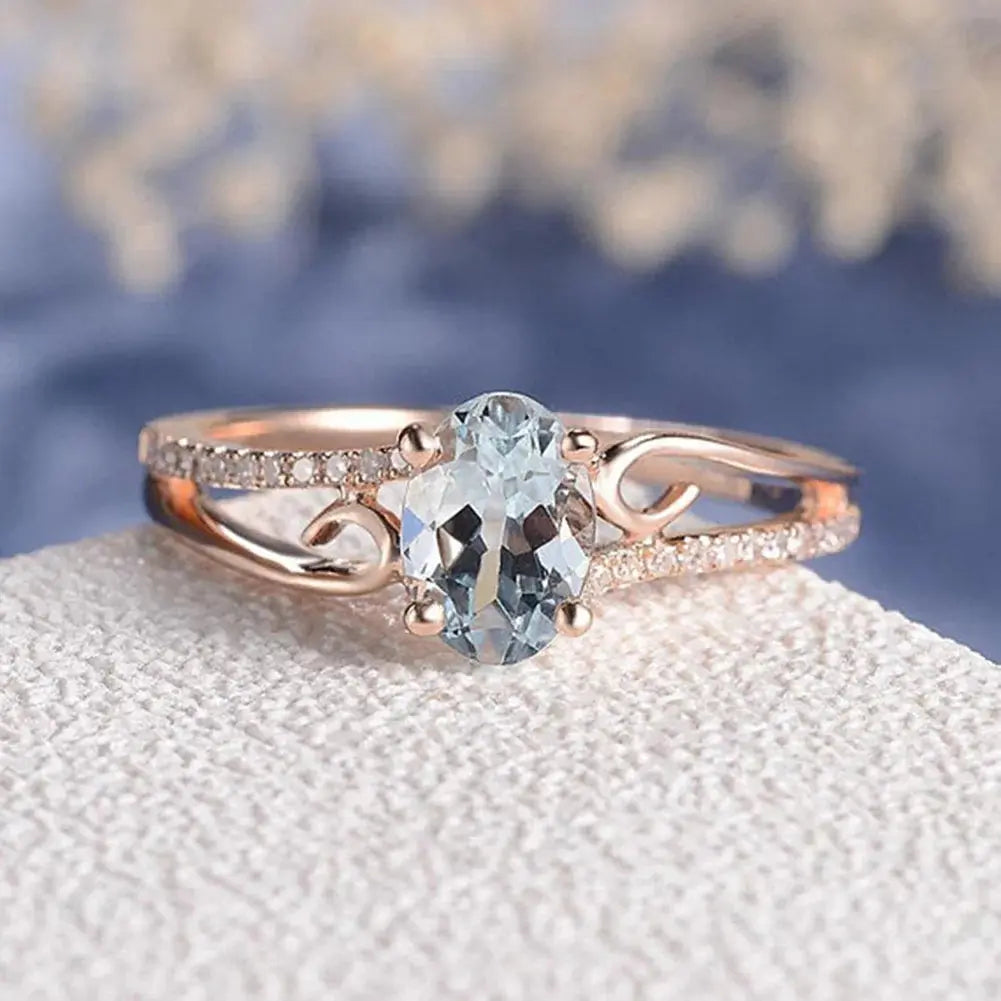 Gold aquamarine ring with elegant design, perfect as a gift for mom or wife, showcasing a sparkling aquamarine gemstone.